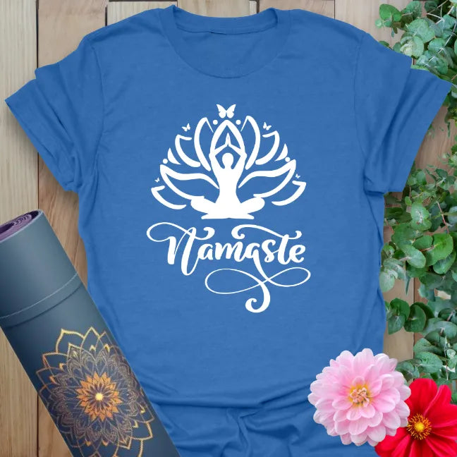 Soft cotton unisex yoga t-shirt featuring blooming lotus, meditating figure, and "Namaste" script symbolizing gratitude and mindful connection.
