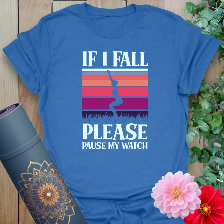 Soft cotton unisex yoga t-shirt featuring funny "If I Fall Please Pause My Watch" quote and balancing yogi design for playful mindful living.