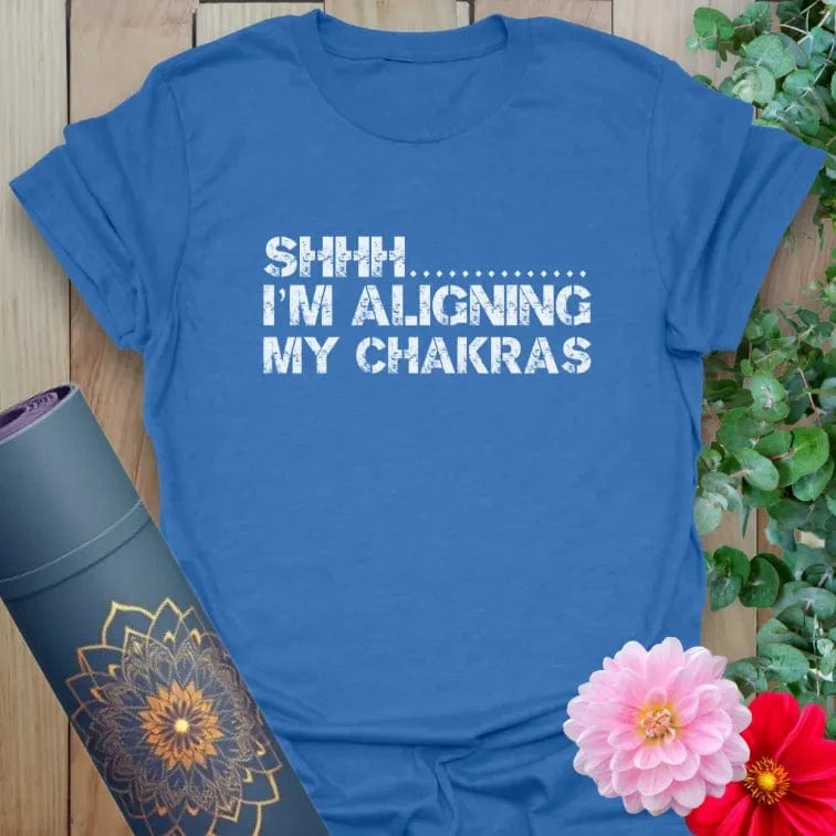 Soft cotton unisex yoga t-shirt featuring playful "Shhh... I’m Aligning My Chakras" quote for mindful, soulful living.