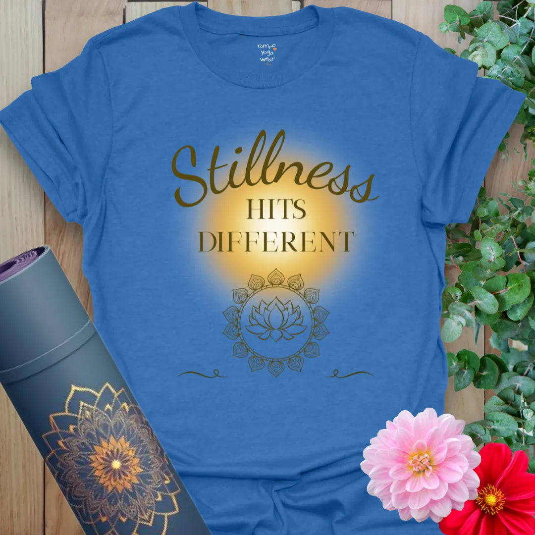 Heather Royal Stillness Hits T-Shirt with warm script and mindful messaging. A calming unisex tee for yogis who love quiet power.