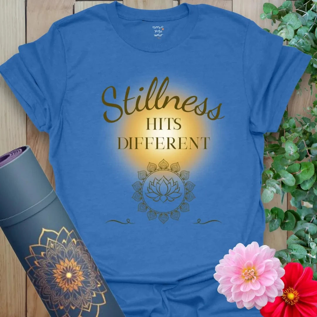Heather Royal Stillness Hits T-Shirt with warm script and mindful messaging. A calming unisex tee for yogis who love quiet power.