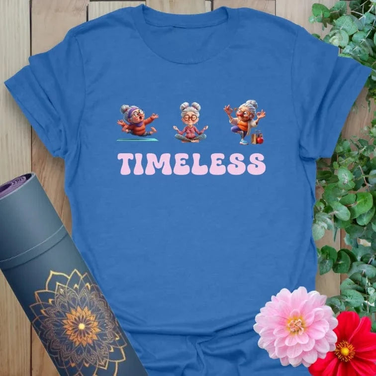 Soft cotton t-shirt with joyful elder yogi illustration and “TIMELESS” text for age-positive movement and playful style.