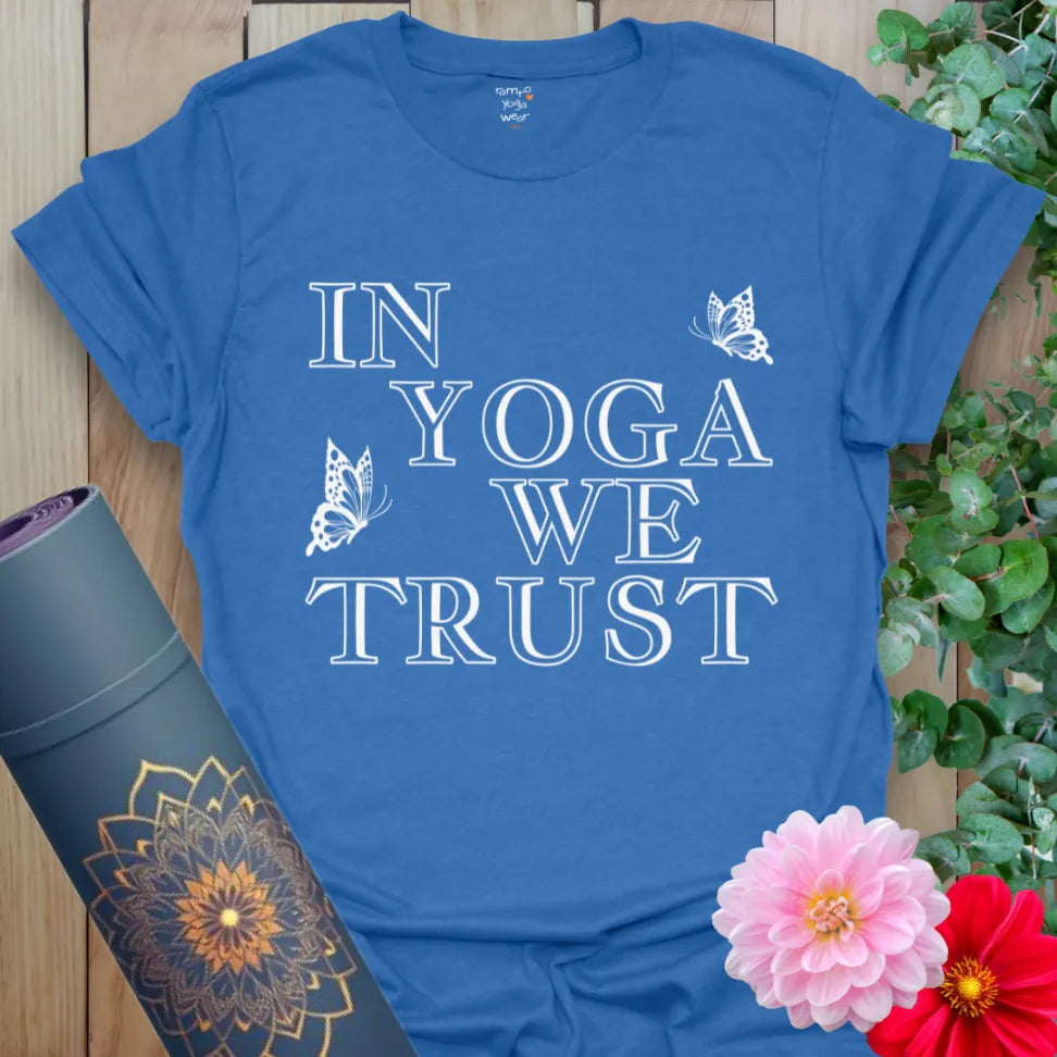 Soft cotton yoga tee with “In Yoga We Trust” quote and butterfly details for mindful movement and spiritual devotion.