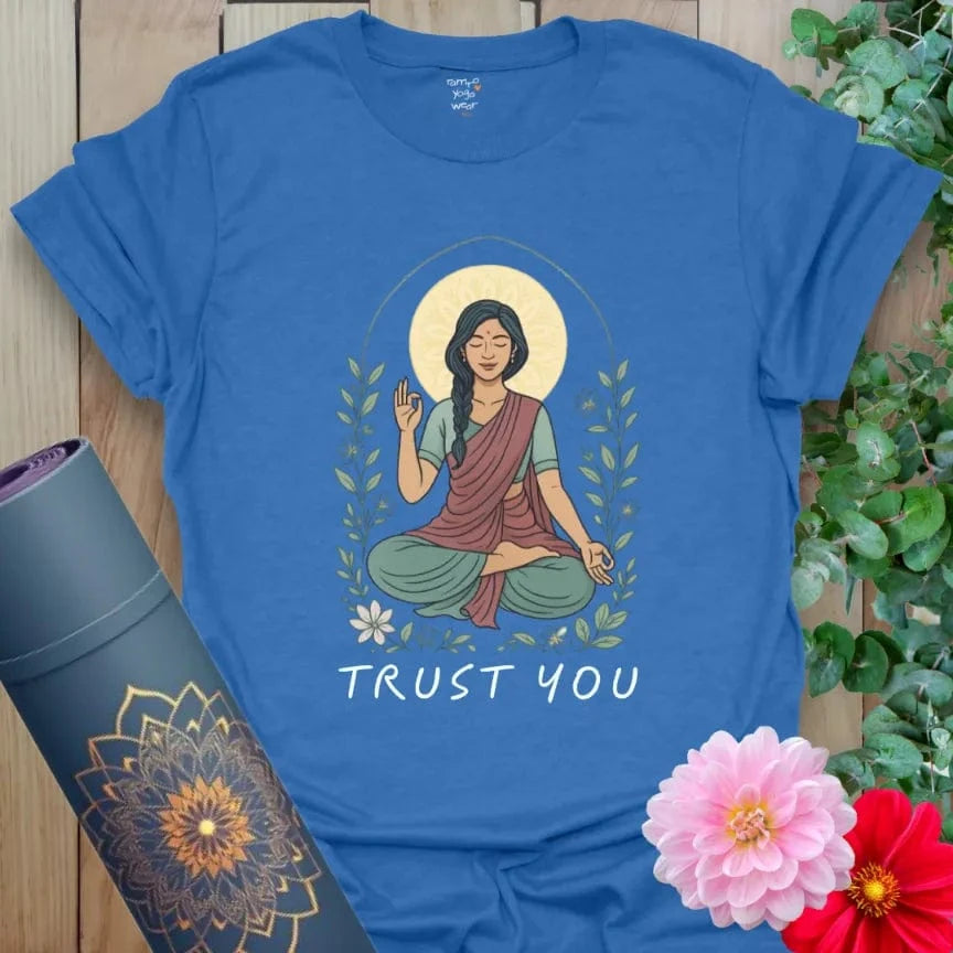Soft cotton yoga tee featuring serene goddess figure in meditation with “Trust You” message and nature-inspired framing.
