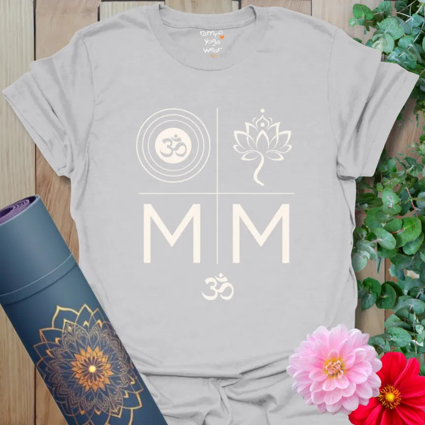 Ice Grey T-shirt with soft cream mantra design in quadrant layout. Includes Om, lotus, and “M M” motif.