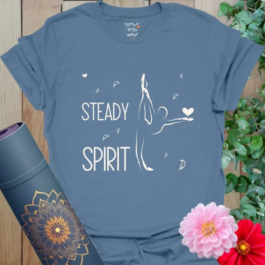 Indigo Blue Steady Spirit T-Shirt featuring minimalist yogi illustration with heart detail and “Steady Spirit” mantra. Unisex yoga clothing for mindfulness.