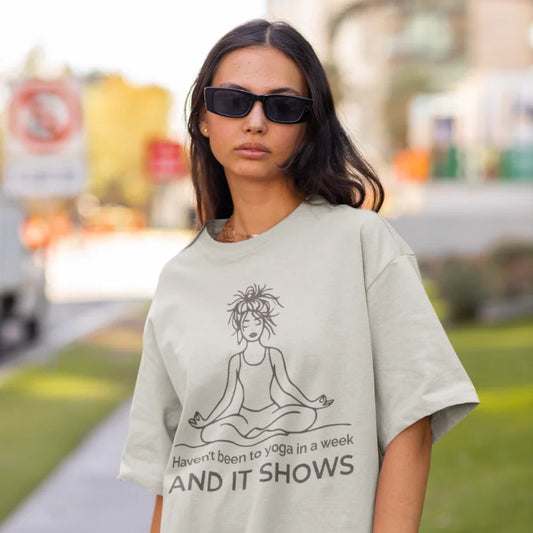 Woman wearing It Shows T-Shirt Ice Grey yoga shirt outdoors with sunglasses — The Vault collection by Ramro Yoga Wear