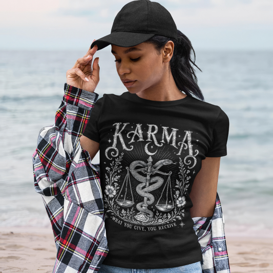 Woman wearing Karma black sacred yoga shirt at the beach — Sacred Thread collection by Ramro Yoga Wear
