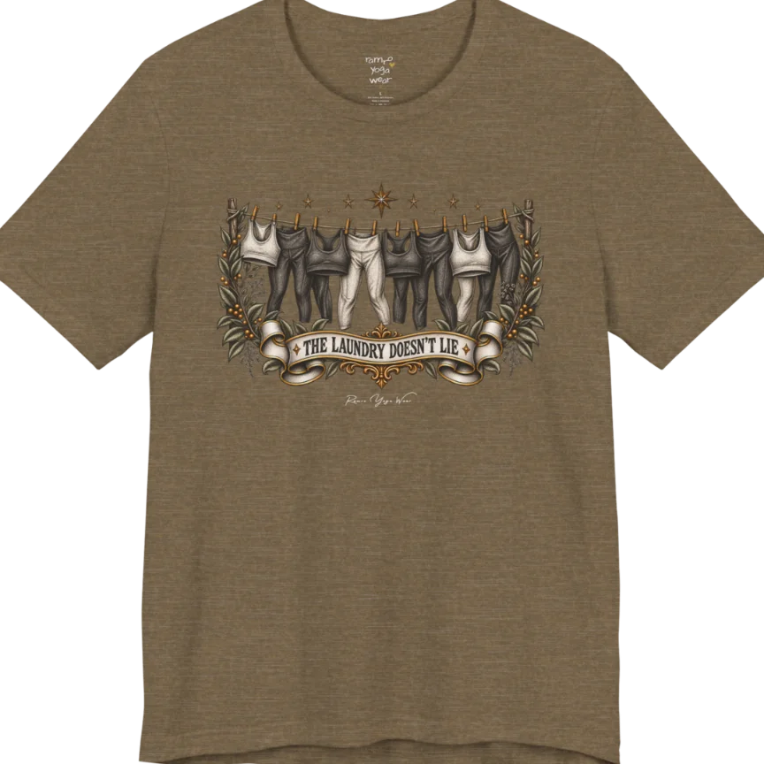 A short sleeved tee. Illustrated clothesline strung with repeating pairs of leggings and tops, framed by botanical leaf sprigs and stars. Laundry T-Shirt flat lay is a Bella+Canvas 3001 and the color is Heather Olive.