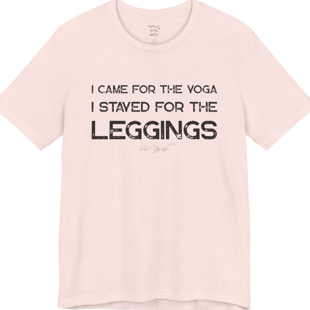 Soft Pink color short-sleeve t-shirt with a white graphic text print that reads 'I CAME FOR THE YOGA I STAYED FOR THE LEGGINGS'. For the one who enjoys a giggle.