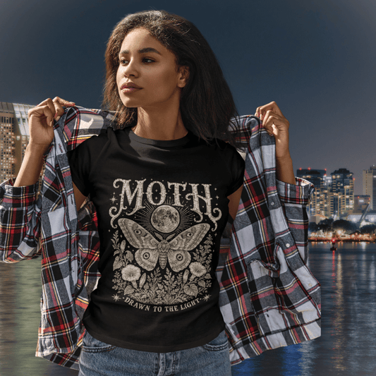 Ramro Yoga Wear Moth tee in Black — lifestyle shot, waterfront night, moth moon botanical vintage engraving
