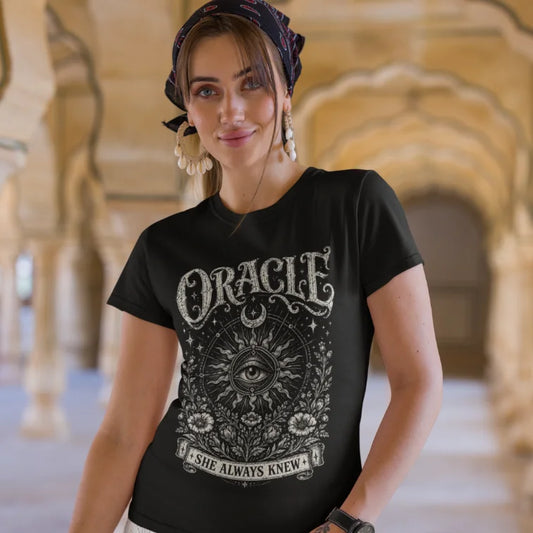 Ramro Yoga Wear Oracle tee in Black — all-seeing eye celestial sun sacred geometry design, temple stone arches lifestyle shot