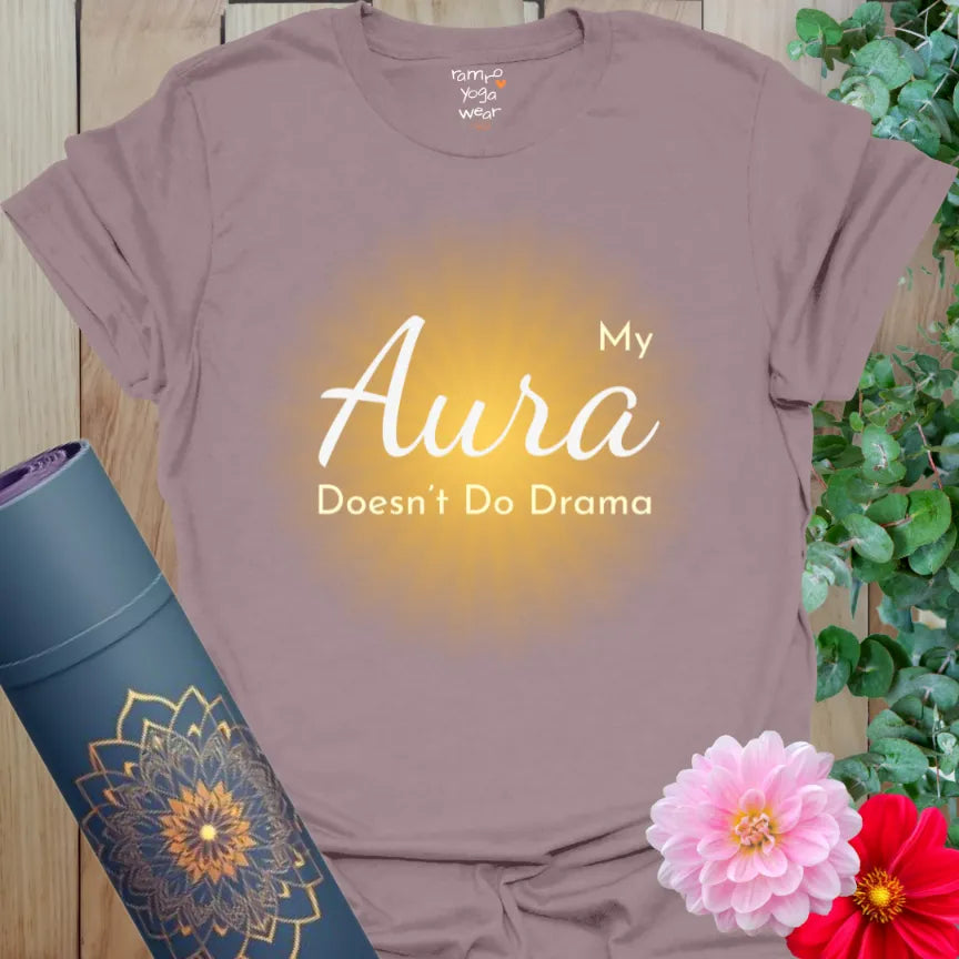 Muted purple tee with warm glow and “My Aura Doesn’t Do Drama” in white and gold. Peaceful statement shirt with spiritual sass.