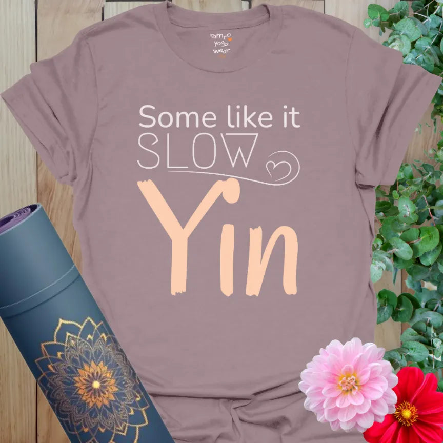 Paragon Yin T-Shirt with soft peach text “Some Like It Slow – Yin.” Yoga shirt for calm energy and introspective flow.