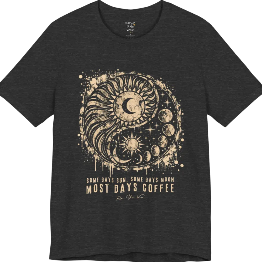 A short sleeved tee called the Phases T-Shirt, flat lay and a Bella+Canvas 3001 shirt. Simply says, Some Days Sun, Some Days Moon, Most Days Coffee. Design highlights a grunge yin yang made of a radiating sun and a tail of moon phases, with stars and ink splatter. Color is Dark Grey Heather.