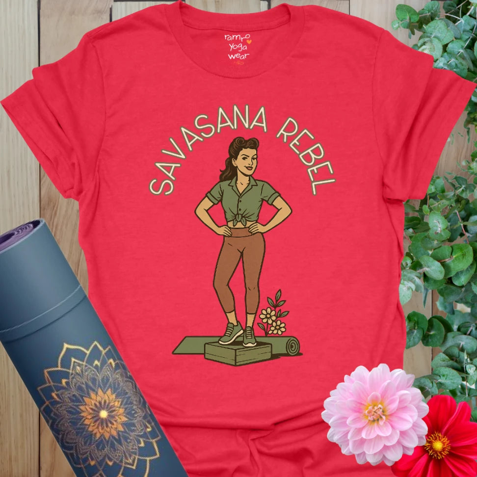 Bold red yoga t-shirt with vintage-style yogi print standing tall on a yoga mat with flowers.