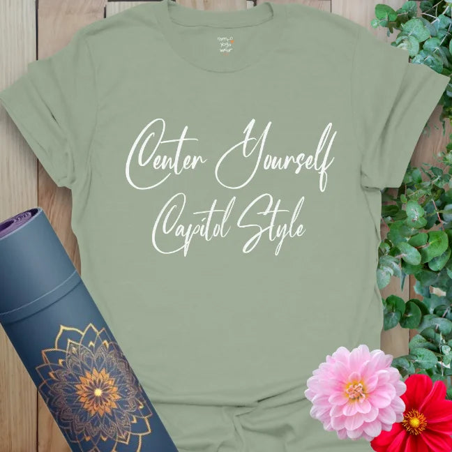 Sage green yoga tee with soft white lettering: “Center Yourself – Capitol Style.” Peaceful tone meets mindful wit in a cozy everyday shirt.