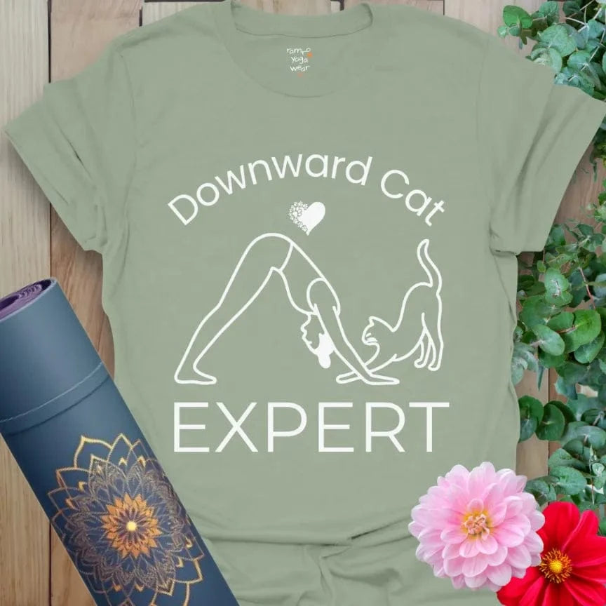 Sage Cat Expert T-Shirt, soft cotton yoga shirt with cat and yogi design, playful illustration, text "Downward Cat Expert."