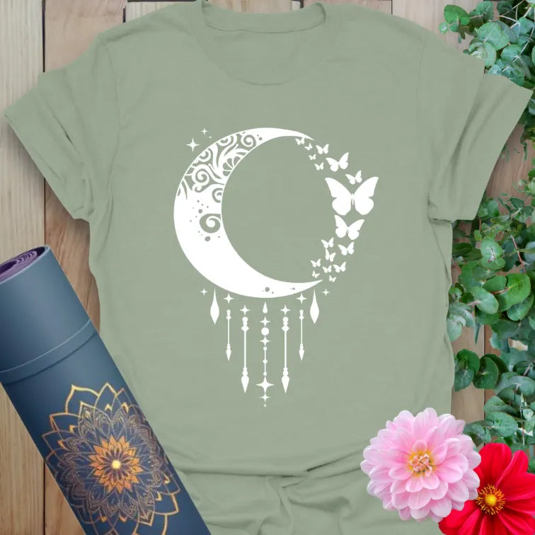Sage green yoga tee with swirling crescent moon and delicate stardust details