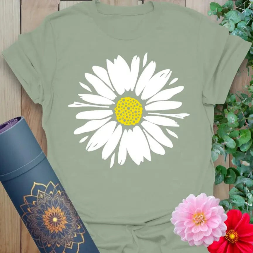 Sage green yoga tee with pastel pink daisy and bright yellow center artwork