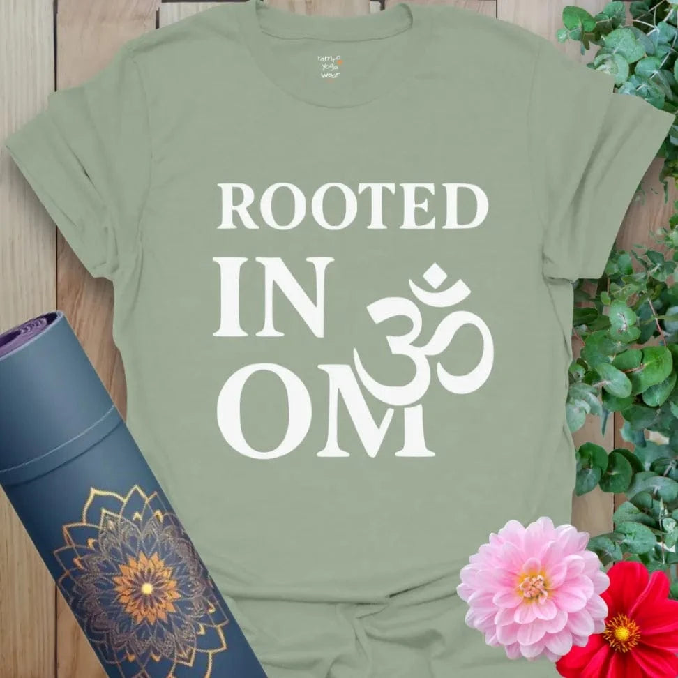 Sage green yoga tee with sacred OM symbol and grounding spiritual mantra