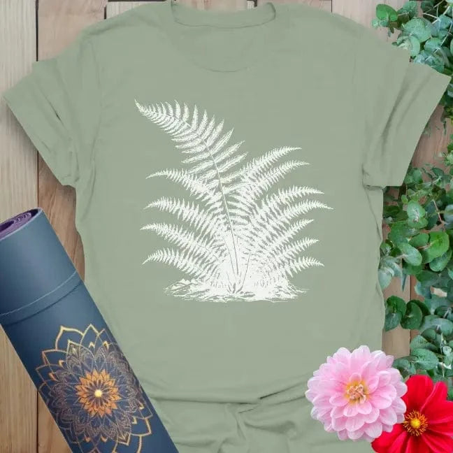 Calm sage green yoga t-shirt featuring graceful fern illustration for grounded, nature-connected living.