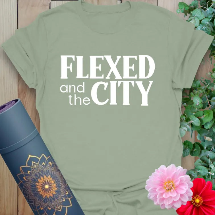 Calm sage green yoga t-shirt featuring bold flex-inspired design for strong, conscious movement in daily life.