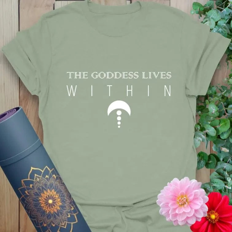 Calm sage green yoga t-shirt featuring sacred feminine affirmation and minimalist spiritual symbol for grounded, empowered living.