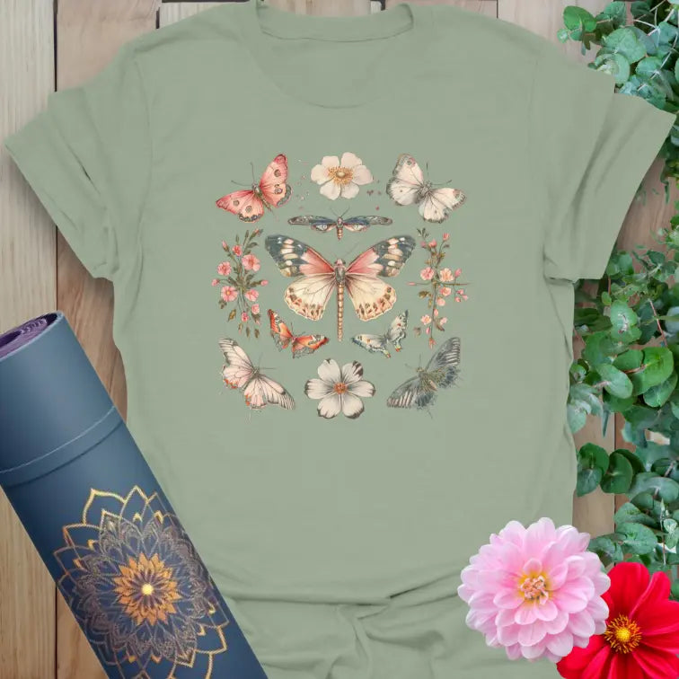 Calm sage green yoga t-shirt featuring butterflies and blooms symbolizing renewal, mindful movement, and soulful living.