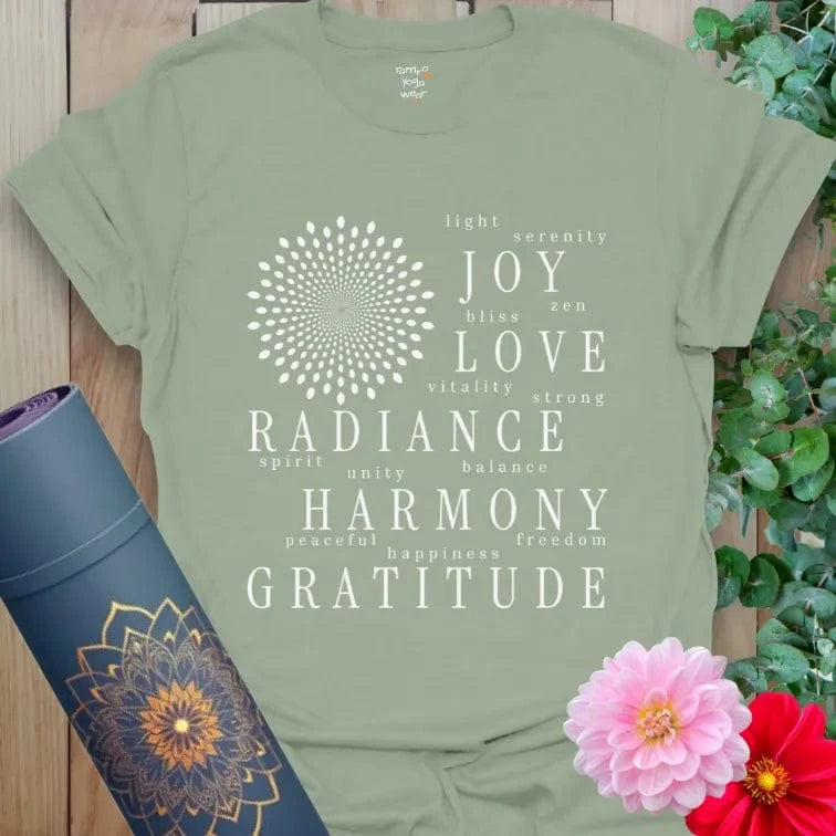Soft sage green yoga tee decorated with gratitude affirmations in a mandala-style layout.