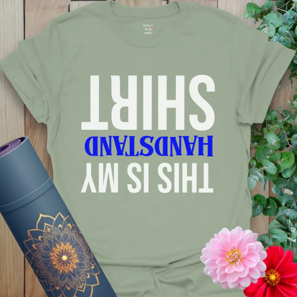 Calm sage green yoga t-shirt featuring humorous upside-down message perfect for acro-yoga lovers and mindful adventurers.