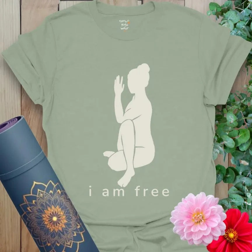 Sage I Am Free T-Shirt with calming yogi illustration in meditative twist and affirmation “I Am Free.” Soft cotton yoga clothing for mindful comfort.