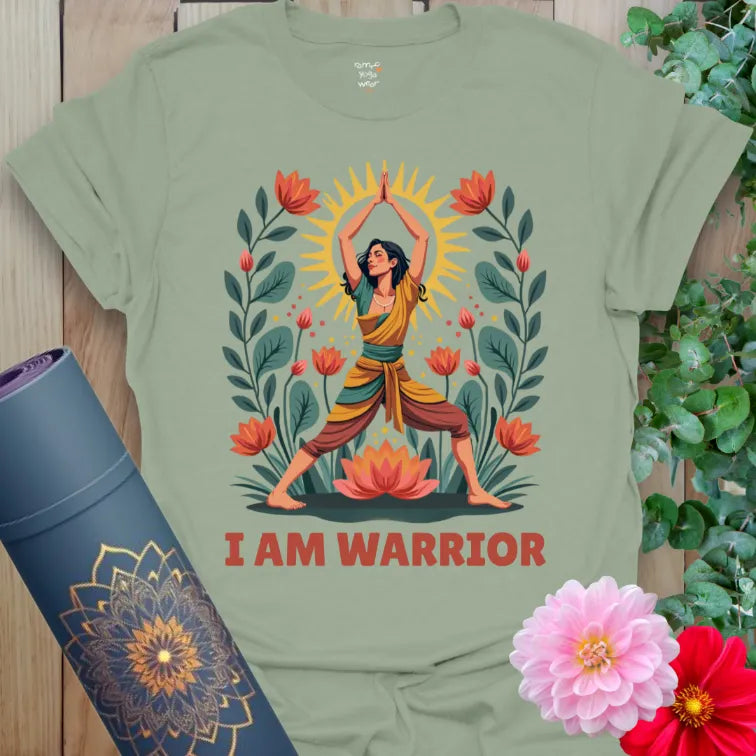 Calm sage green yoga t-shirt with empowering yogi in Warrior Pose surrounded by flourishing lotuses and glowing sun energy.