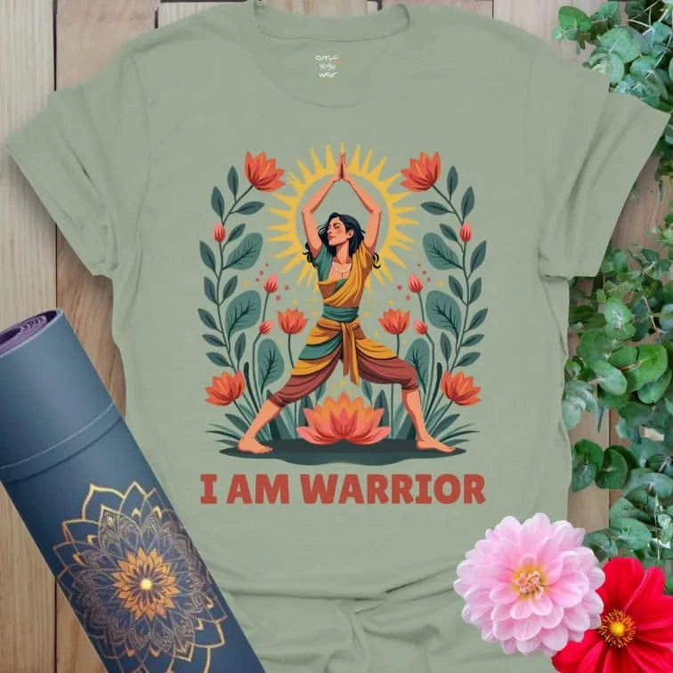 Calm sage green yoga t-shirt with empowering yogi in Warrior Pose surrounded by flourishing lotuses and glowing sun energy.