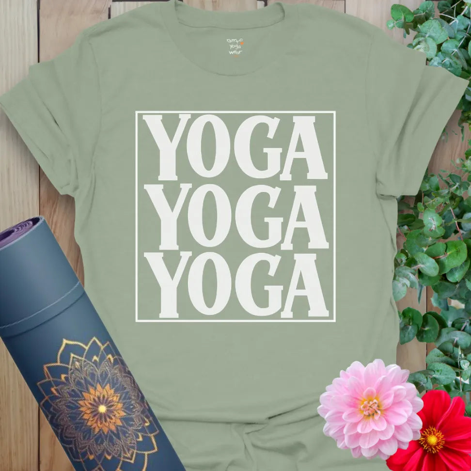 Calm sage green yoga t-shirt with bold triple "YOGA" framed design symbolizing conscious movement and grounded living.