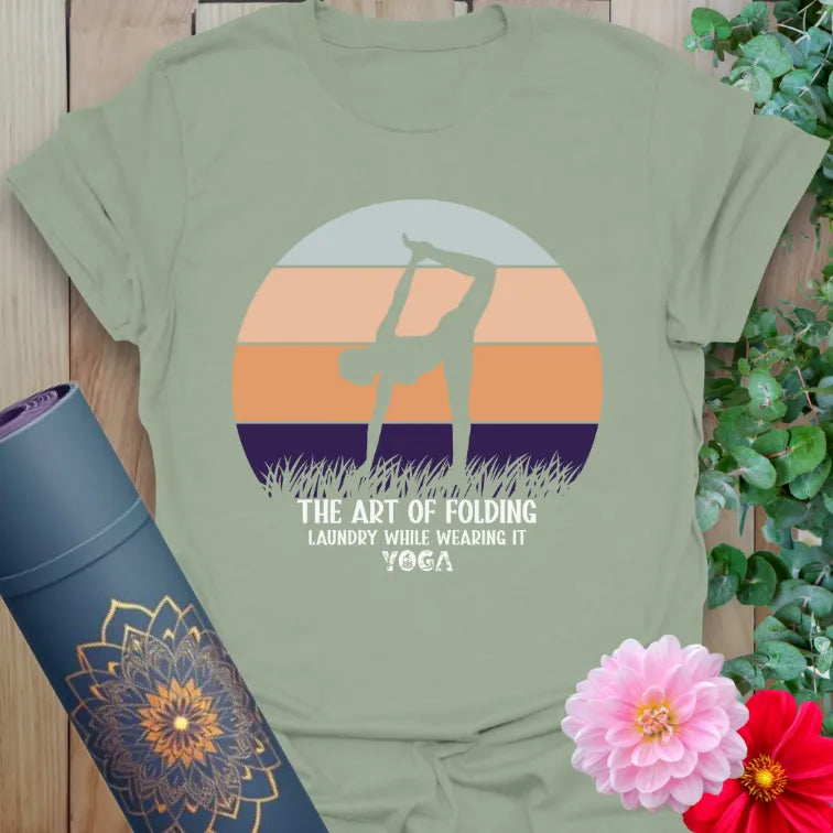 Calm sage green yoga t-shirt with lighthearted yoga folding quote and yogi silhouette perfect for soulful laughter and mindful flow.