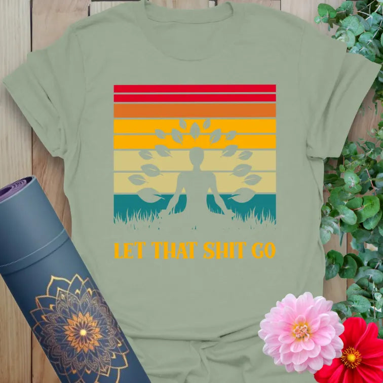 Calm sage green yoga t-shirt with bold "Let That Sht Go" quote and retro yoga design perfect for grounded, soulful living.