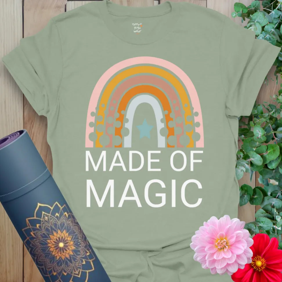 Calm sage green yoga t-shirt featuring retro rainbow and "Made of Magic" quote celebrating conscious, joyful living.