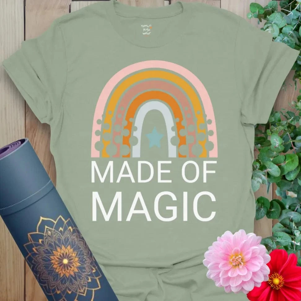 Calm sage green yoga t-shirt featuring retro rainbow and "Made of Magic" quote celebrating conscious, joyful living.