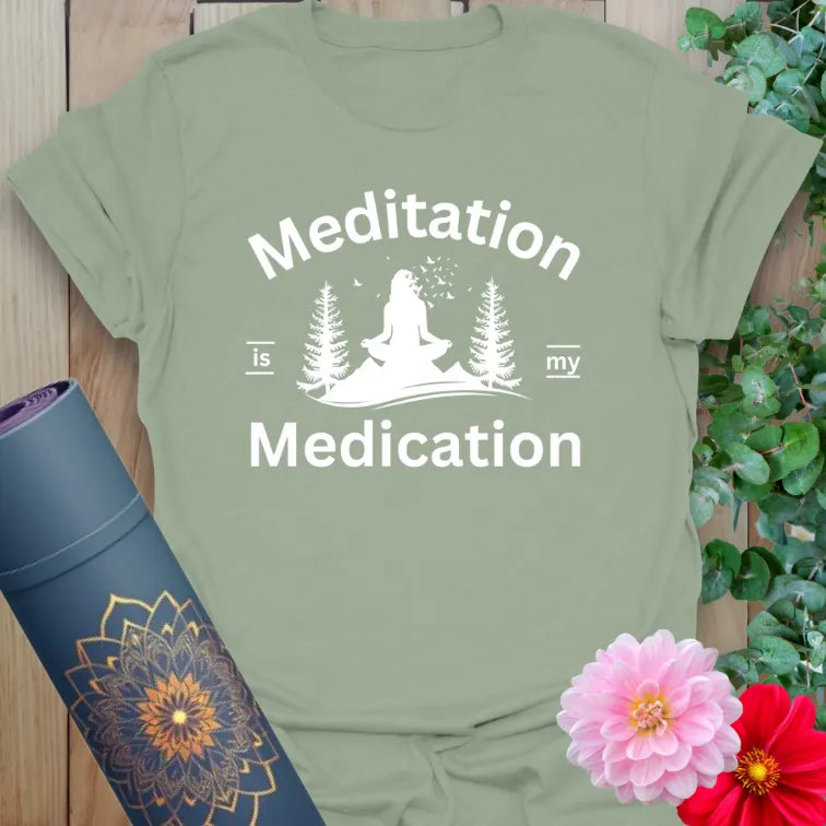Calm sage green yoga t-shirt featuring peaceful yogi meditation and mindful forest scene for grounded, heart-centered living.