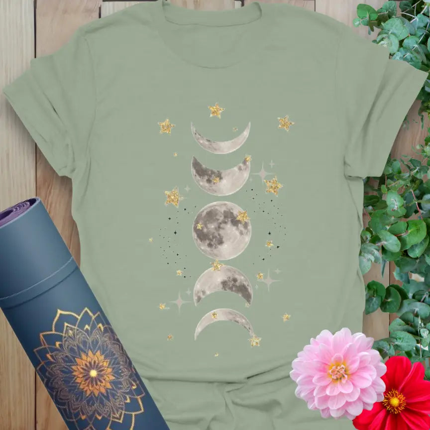 Calm sage green yoga t-shirt featuring moon phases and glowing stars design inspiring soulful presence and celestial connection.