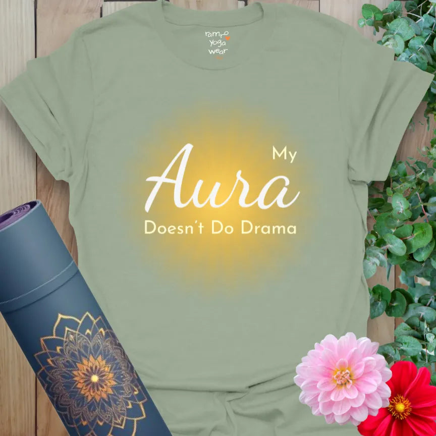 Earthy green tee with golden sunburst and calming slogan. Mindful fashion with high-vibe intention.