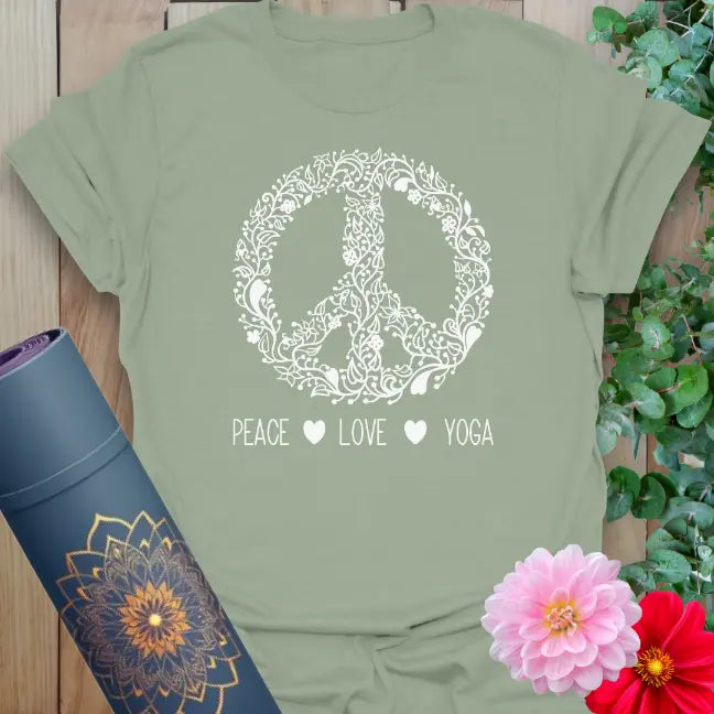 Calm sage green yoga t-shirt featuring floral peace emblem and conscious movement mantra for grounded, soulful living.