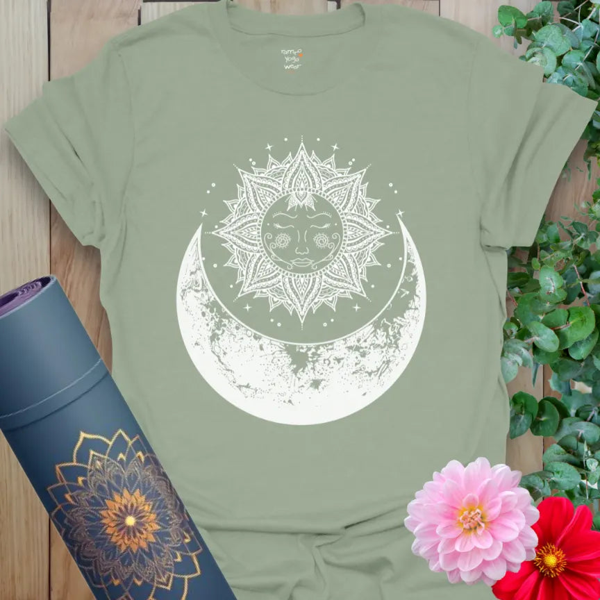 Calm sage green yoga t-shirt featuring celestial mandala and moon phases artwork symbolizing balance, renewal, and spiritual alignment.