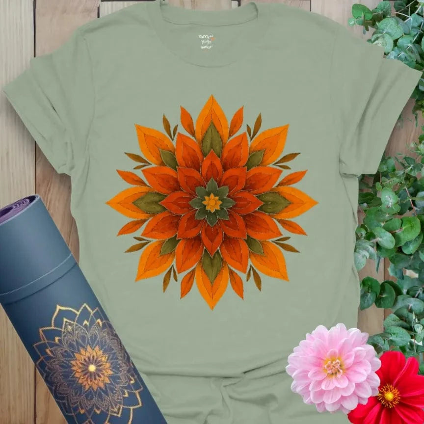 Calm sage green yoga t-shirt featuring earthy sacred flame mandala symbolizing grounded spiritual energy and mindful blooming.