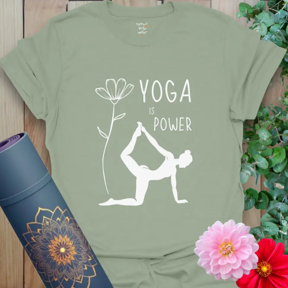 Sage Soft Power T-Shirt with yoga design — Dancer’s Pose next to a flower.