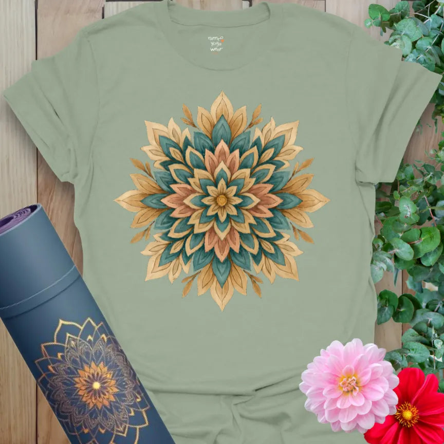 Calm sage green yoga t-shirt featuring earthy mandala flower artwork for grounded self-expression and spiritual connection.