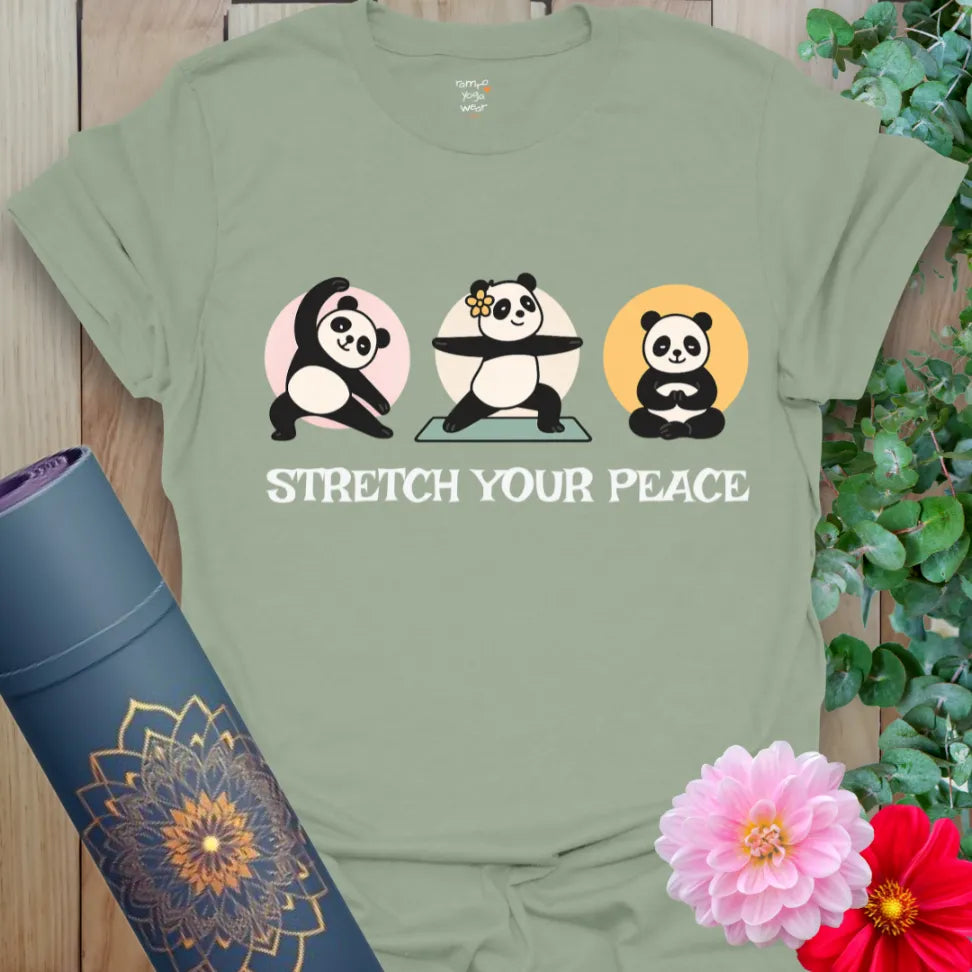 Sage green yoga t-shirt showcasing meditating pandas and “Stretch Your Peace” text for mindful humor and comfort.