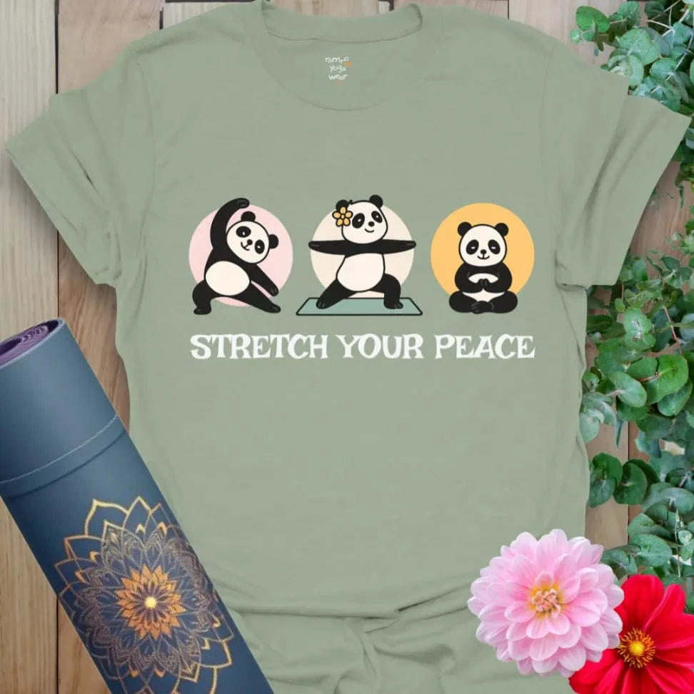 Sage green yoga t-shirt showcasing meditating pandas and “Stretch Your Peace” text for mindful humor and comfort.