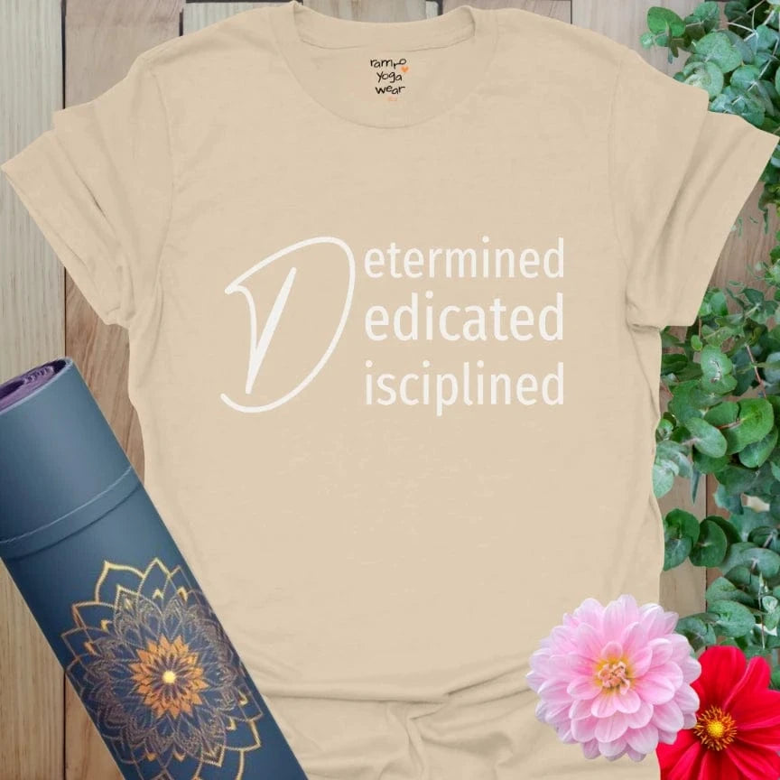 Sand Determined T-Shirt with white typographic design. A subtle, soulful expression of inner resolve.